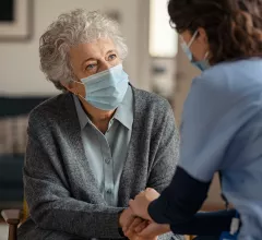 Patient doctor with masks. A team of specialists from Cleveland Clinic reviewed nearly 3,000 medications, writing that a common type 2 diabetes medication offered the most potential as an effective treatment for AFib. 