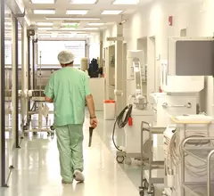 doctor walks hospital corridor