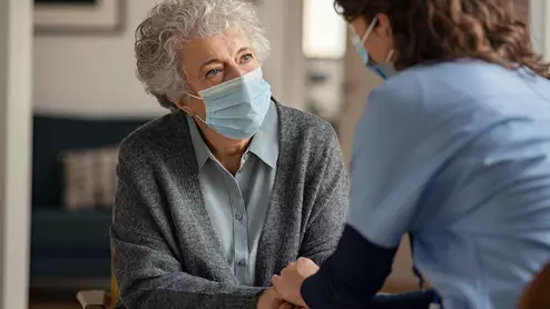 Patient doctor with masks. A team of specialists from Cleveland Clinic reviewed nearly 3,000 medications, writing that a common type 2 diabetes medication offered the most potential as an effective treatment for AFib. 