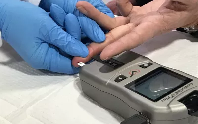 A point-of-care A1C and lipid blood test being performed on the expo floor by PTS Diagnostics. The test requires just a drop of blood and results can be shown in about 90 seconds. #ACC2022